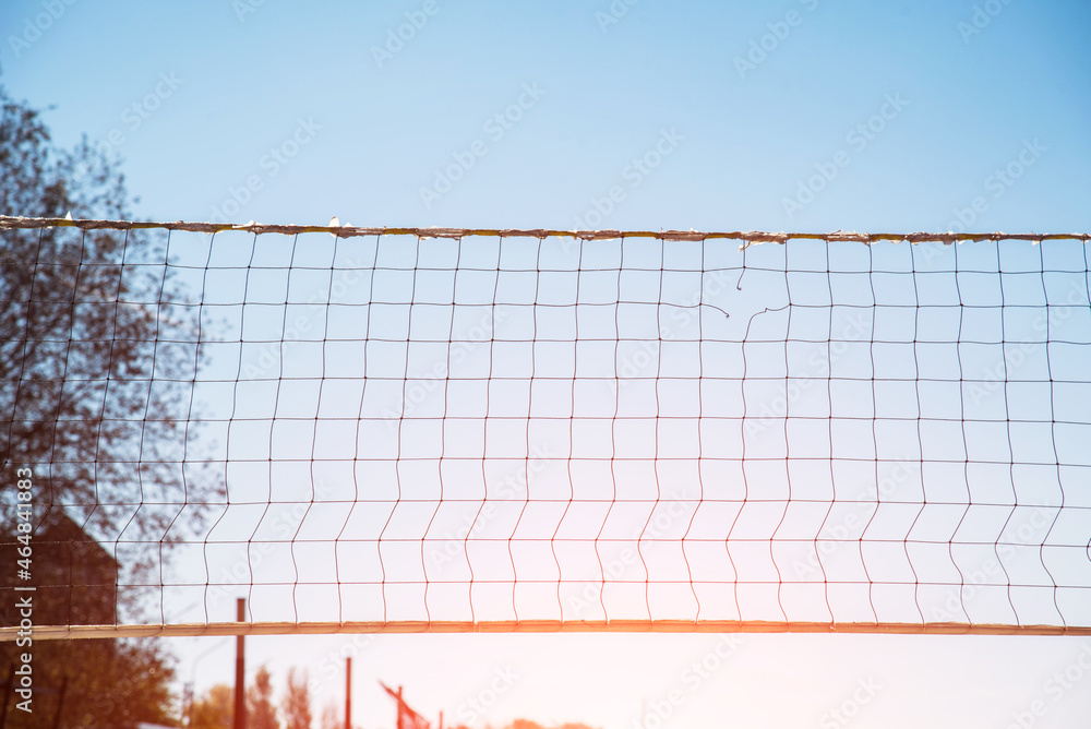 Torn volleyball net on the background of the sky (failure, loss, breakdown - concept)
