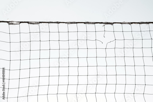 Obraz na płótnie Torn volleyball net on sky background (failure, loss, breakdown - concept) w salonie