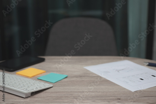 working table at office with pen, business graph or chart, keyboard, sticky note and smartphone. for business and accounting concept.