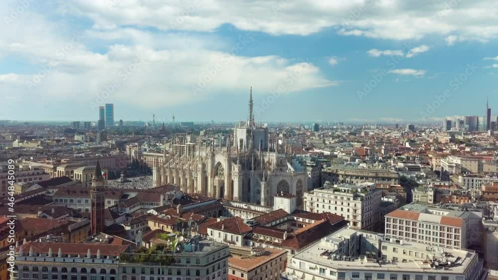 Milano, Italian city and coronavirus outbreak. Aerial view of Piazza Duomo. Historic monument and religious building seen from drone flying in sky. Milano, Italian city and coronavirus outbreak. Aerial view of Piazza Duomo. Historic monument and religious building seen from drone flying in sky.