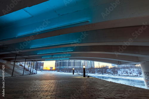 space under the bridge with artificial lighting