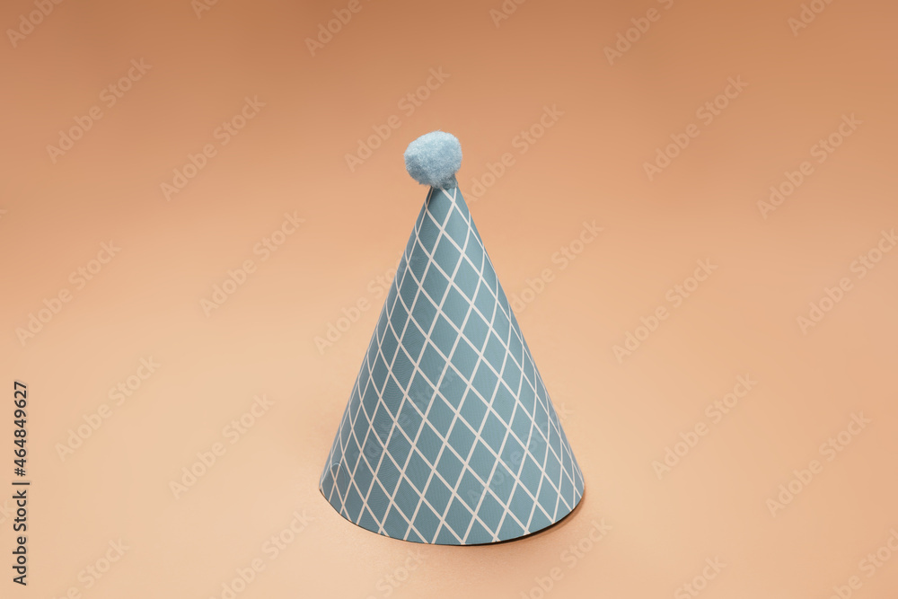 Fototapeta premium Colorful birthday cap on brown background.