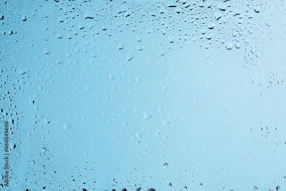 Blue backgrond with water drops. Wet glass. Blue backgrond with water drops. Wet glass.