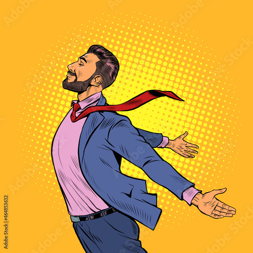 a joyful man stands in the wind, opened his hands to the elements. Strong leader businessman