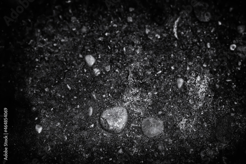 dirty pattern with pebbles and gravel in dark black and white version