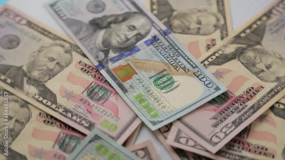 Dollars spread out on the table rotate in a circle Dollars spread out on the table rotate in a circle