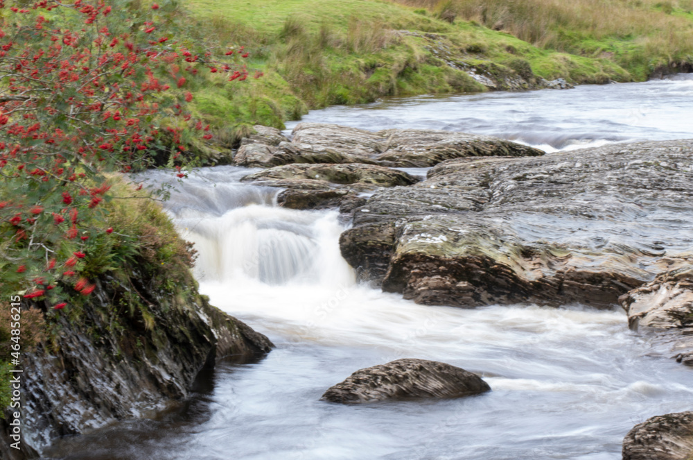 Fototapeta premium Water flowing over rocks