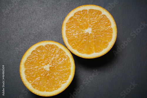 fresh oranges on black background