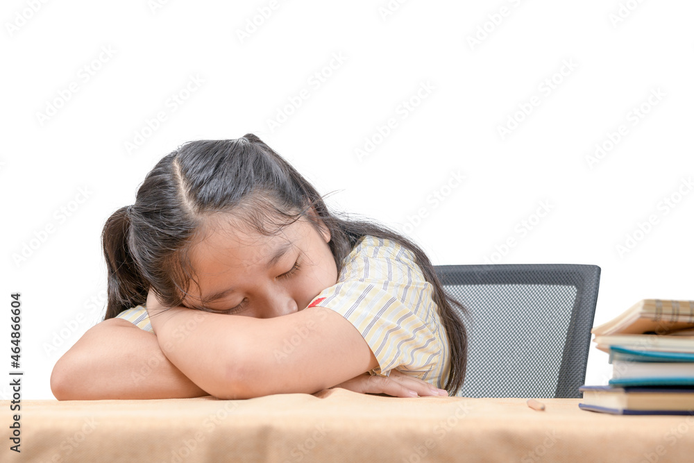 Asian tired little girl sleeping at work desk, lying on table isolated on white, Asian tired little girl sleeping at work desk, lying on table isolated on white,