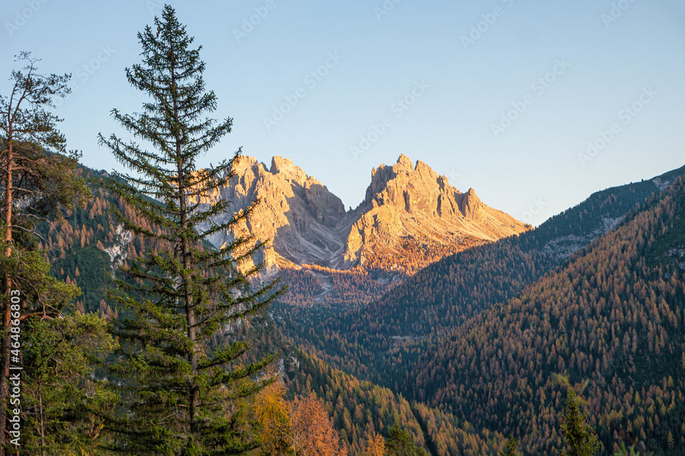 Magical nature in Dolomites at the national park Three Peaks (Tre Cime, Drei Zinnen) during sunset and golden Autumn, South Tyrol, Italy. Magical nature in Dolomites at the national park Three Peaks (Tre Cime, Drei Zinnen) during sunset and golden Autumn, South Tyrol, Italy.