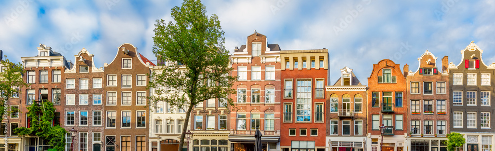 Panoramic view of Amsterdam houses and rooftops. No logos and inscriptions. Amsterdam, Holland, Netherlands, Europe.