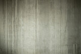 The abstract background is the texture of a concrete gray wall.