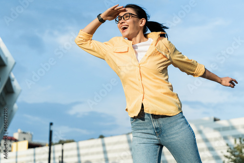 Fotografie Portrait of woman squinting eyes and peering into distance, looking far away with attentive view, searching on horizon and curious to discover