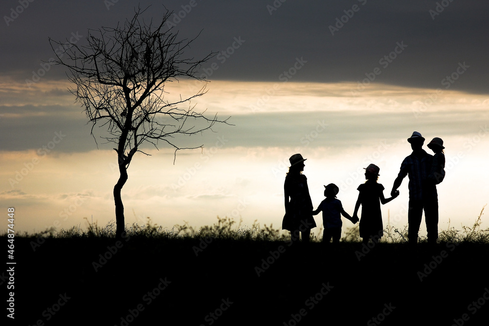 A Happy family silhouette on nature in park background