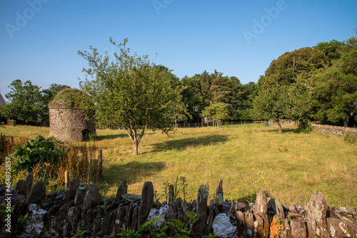 Fototapeta Naklejka Na Ścianę i Meble -  Bigbury, Devon, England, UK. 2021. A listed ancient dry stone constructed Dovecote standing in a small field in Bigbury, south Devon, UK,
