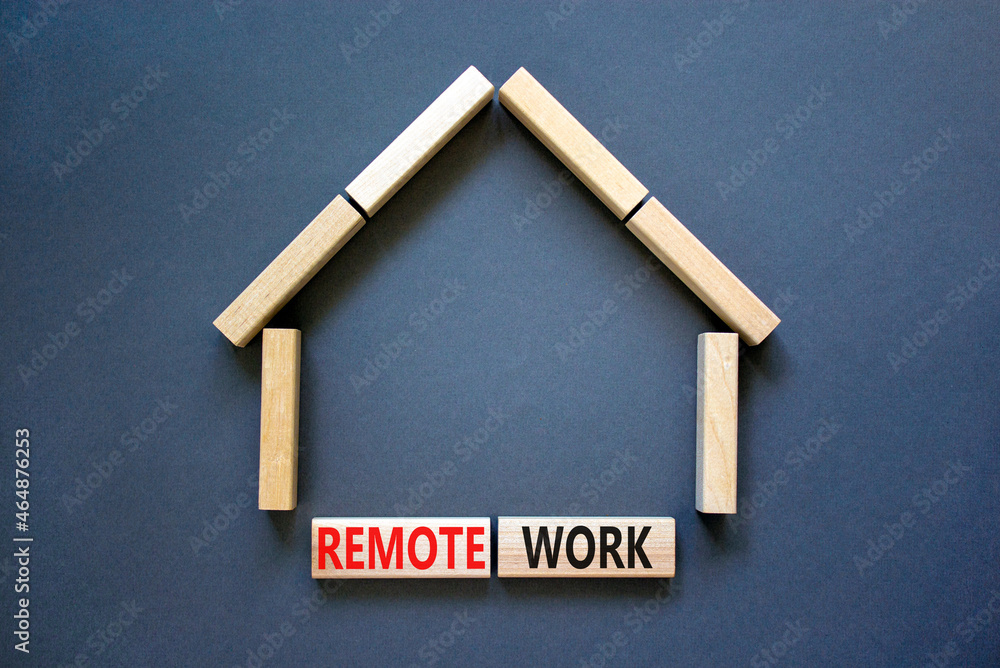 Remote work symbol. Concept words 'Remote work' on wooden blocks near miniature wooden house. Beautiful grey background. Business, remote work concept. Remote work symbol. Concept words 'Remote work' on wooden blocks near miniature wooden house. Beautiful grey background. Business, remote work concept.