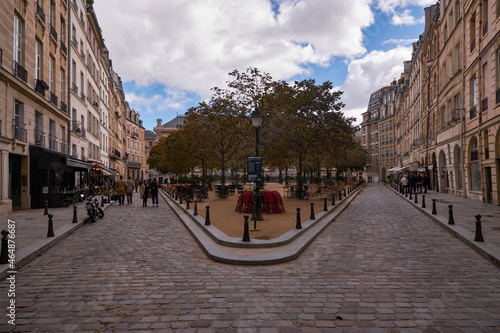 Beautiful Tradional and Old Parisian Bulding Facades with Red and White Bricks in Place Dauphine - Paris, France - Île de la Cité