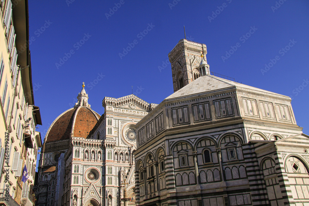Detail of the Florence Duomo or Basilica di Santa Maria del Fiore in Florence, Italy, with the Dome in backgrund, the most famous landmark by Filippo Brunelleschi.