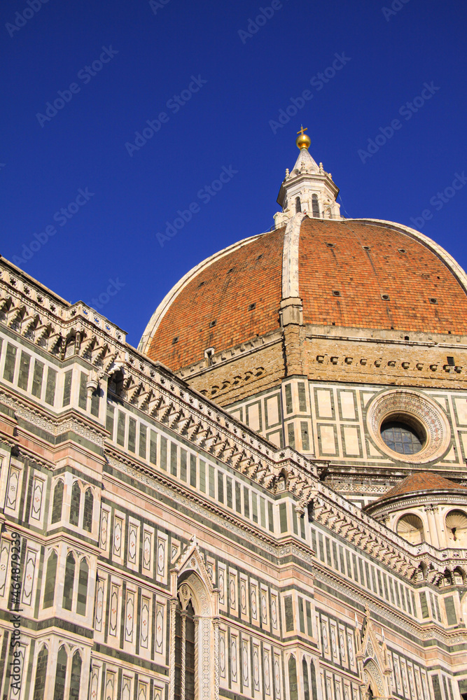 Detail of the Florence Duomo or Basilica di Santa Maria del Fiore in Florence, Italy, with the Dome dominating the backgrund, the most famous landmark by Filippo Brunelleschi.