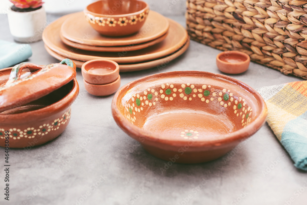 A view of a collection of Mexican clay dishware.
