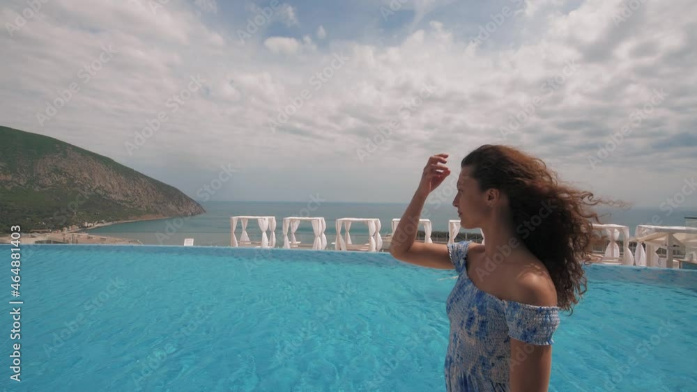 woman walks by the pool woman walks by the pool