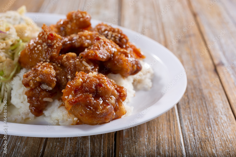 A view of a plate of orange chicken. A view of a plate of orange chicken.