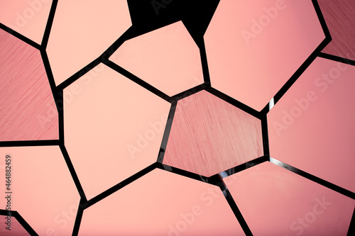 A view of an abstract pink honeycomb wall facade  as a background.
