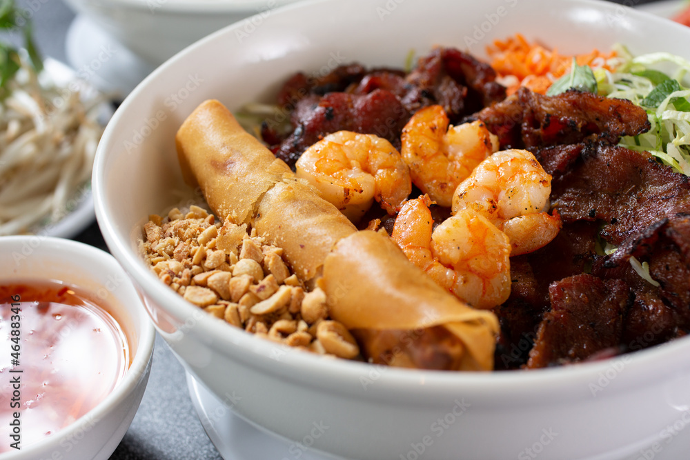 A closeup view of a bowl of Vietnamese vermicelli noodles known as Bún. A closeup view of a bowl of Vietnamese vermicelli noodles known as Bún.