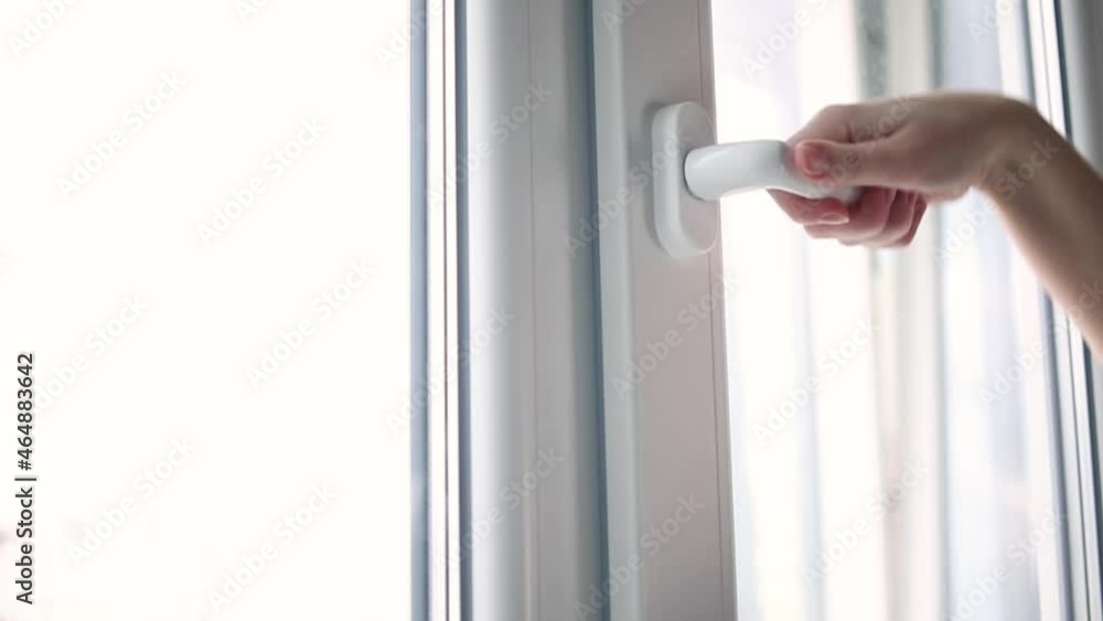 House ventilation, woman hand open white PVC window, slow motion House ventilation, woman hand open white PVC window, slow motion