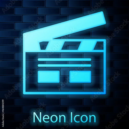 Glowing neon Bollywood indian cinema icon isolated on brick wall background. Movie clapper. Film clapper board. Cinema production or media industry. Vector