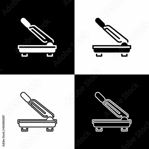 Set Paper cutter icon isolated on black and white background. Vector