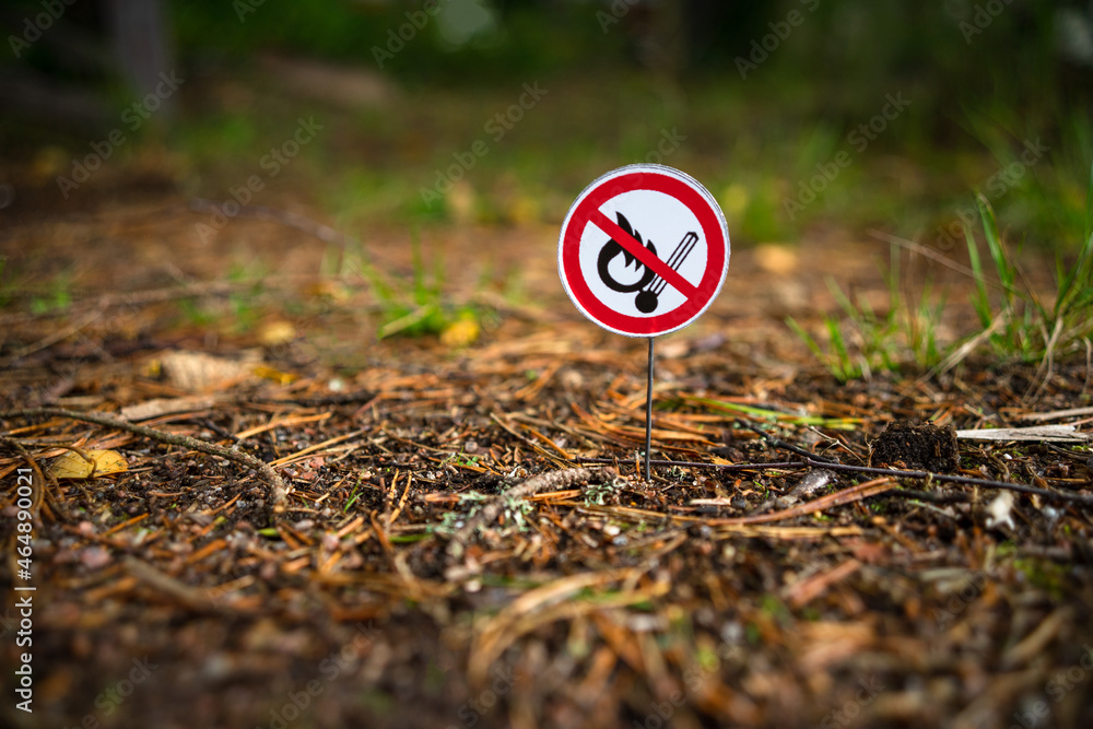 A round sign prohibiting the use of an open fire in nature. Bonfires are prohibited. A flammable area of the forest. A fire-hazardous situation. A crossed out burning match. A round sign prohibiting the use of an open fire in nature. Bonfires are prohibited. A flammable area of the forest. A fire-hazardous situation. A crossed out burning match.