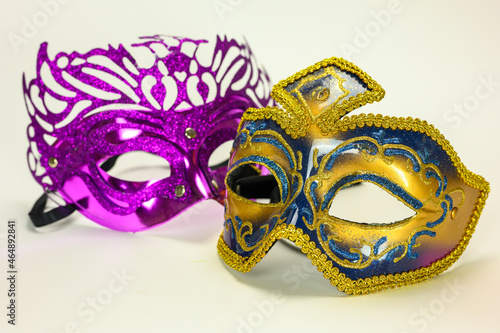 Two Venetian masks on a white background for the carnival masquerade ball.