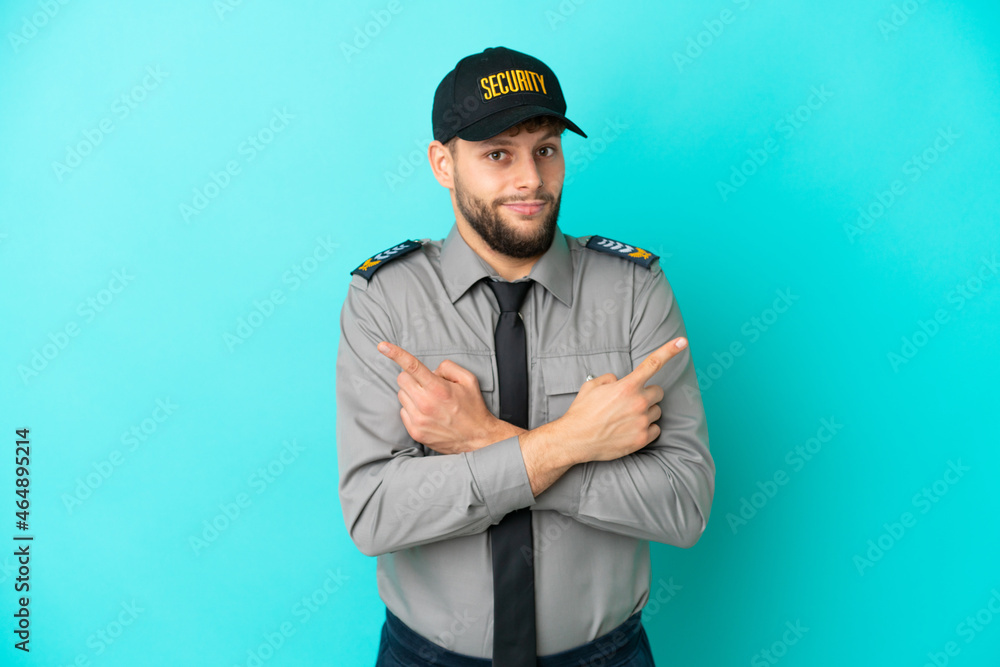 Young security man isolated on blue background pointing to the laterals having doubts Young security man isolated on blue background pointing to the laterals having doubts