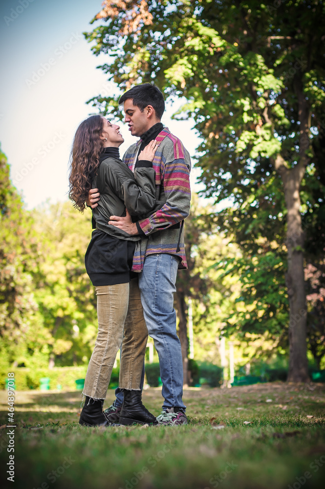 Cheerful and romantic couple hugging and enjoying in in love Cheerful and romantic couple hugging and enjoying in in love