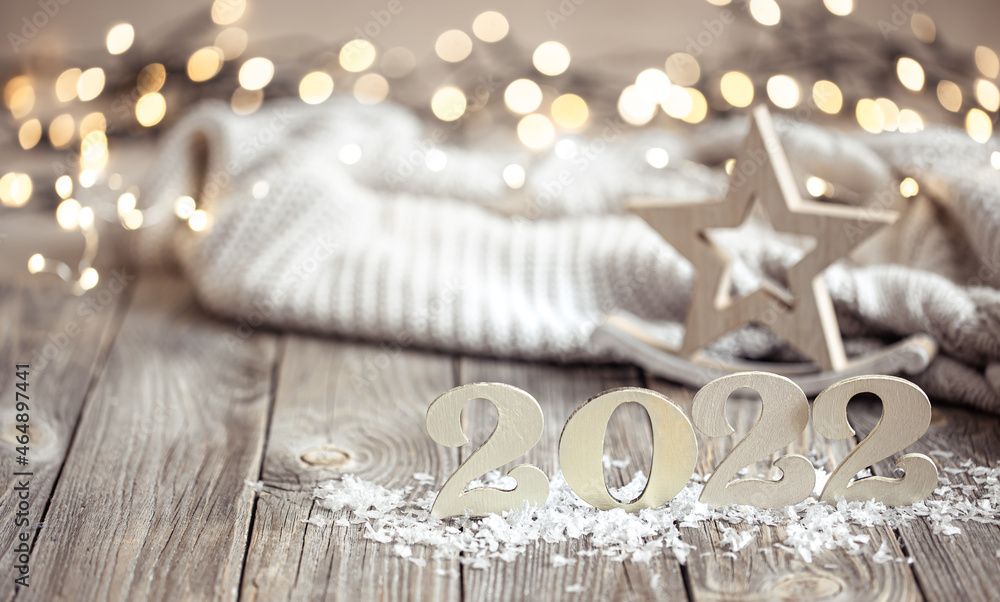 Cozy christmas composition with number 2022 and decor details.