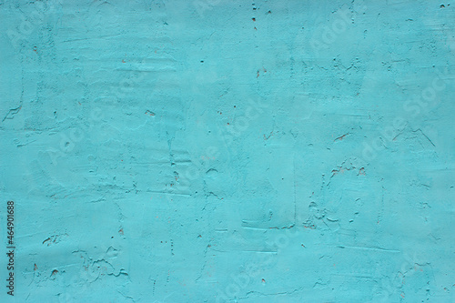 Blue rough cemented wall. Rough surface. Blue textured background. Light blue surface