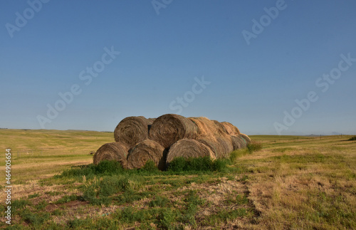 Rural Landscape with Stacked Bails of Hay