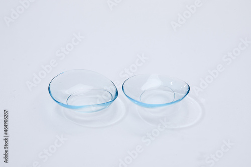 contact lenses on blue background close up view   - Image