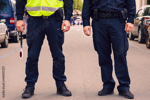 The police officer, the traffic on the road. cop to be near the crosswalk. Traffic Police Officer