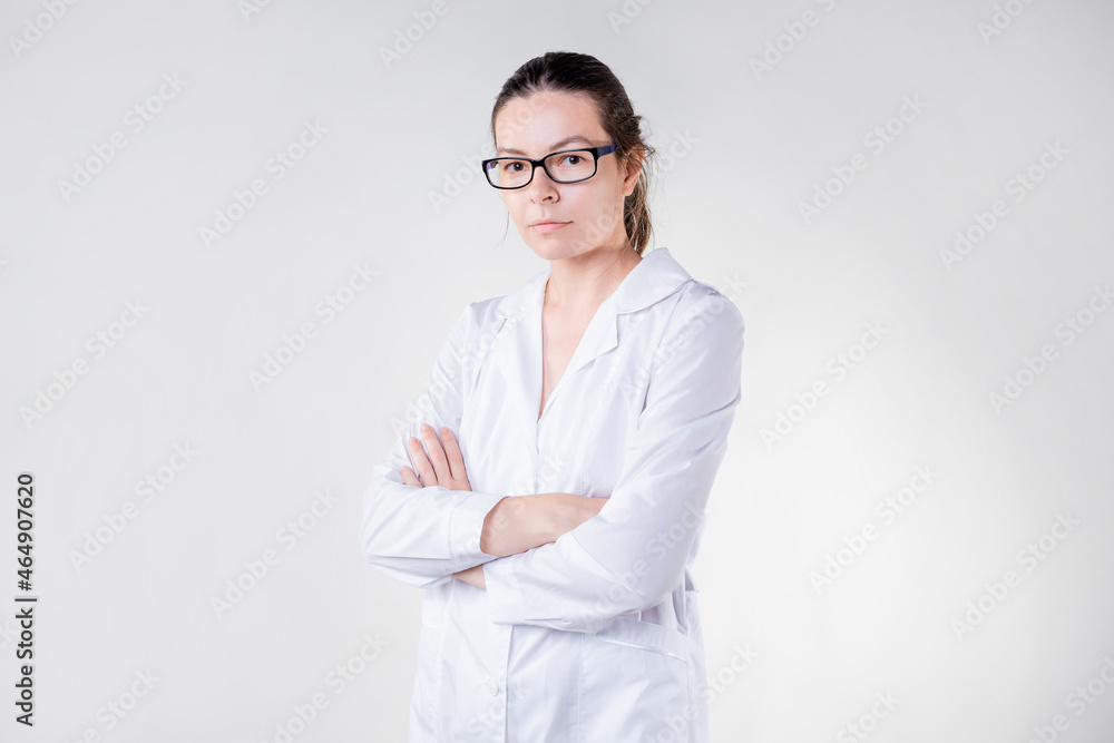 Doctor in a white coat portrait on a white background. Doctor in a white coat portrait on a white background.