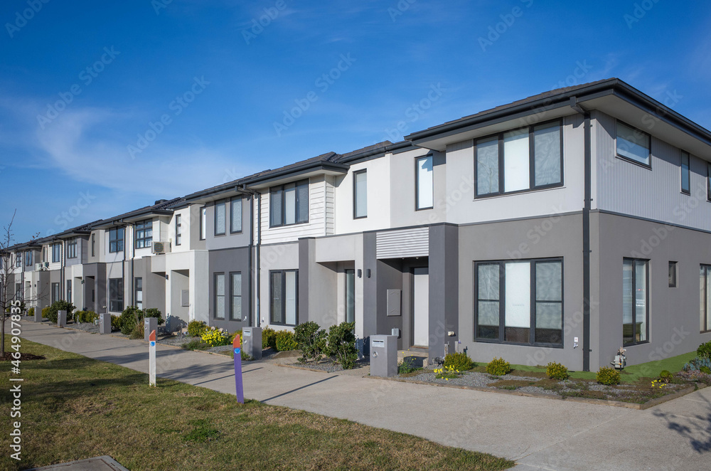 A row of modern residential townhomes or townhouses in Melbourne's suburb, VIC Australia. Concept of real estate development, the housing market, and homeownership..