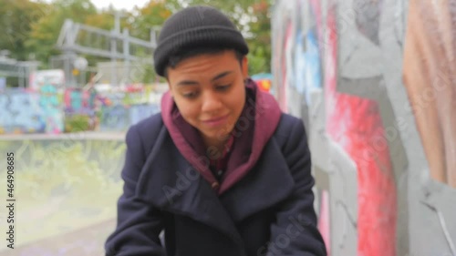 Young female analyzes a cryptocurrency stock market chart on her mobile phone