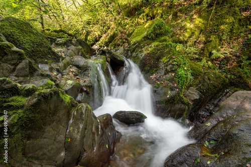 Long exposure of a waterfall on the Hoar Oak Water river at Watersmeet in Exmoor National Park