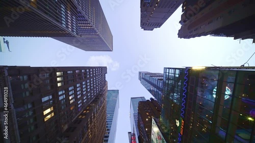 Looking up modern office buildings, high glassy skyscraper, modern offices apartments in New York City. Financial district Manhattan.
