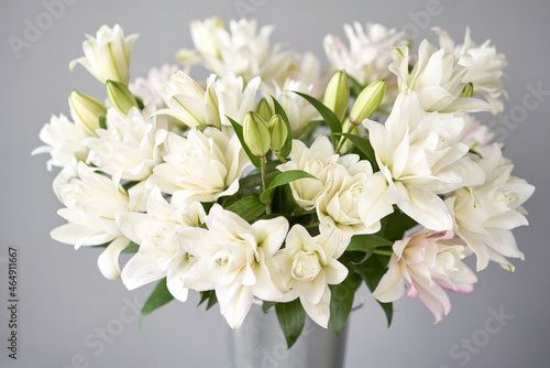 white and pink peony lily in vase. Tender flower petals close up. Natural flower backdrop. Beautiful floral greeting card