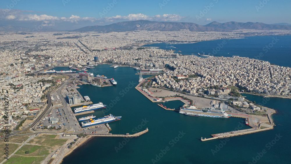 Aerial drone photo of famous and busy port of Piraeus where passenger ferries travel to Aegean destination islands as seen from high altitude , Attica, Greece