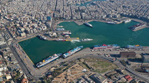 Aerial drone photo of famous and busy port of Piraeus where passenger ferries travel to Aegean destination islands as seen from high altitude   Attica  Greece