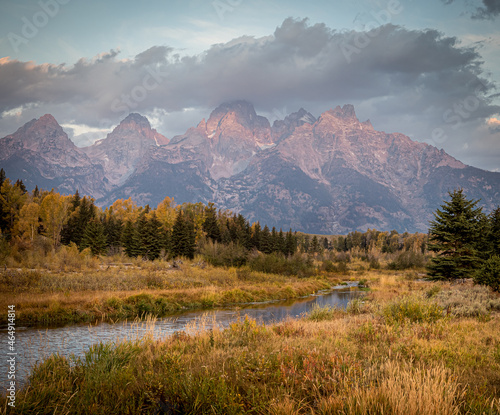 Grand Tetons in early morning with reflected sunrise on mountains
