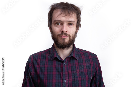 portrait shaggy young bearded man with long hair before haircut.
